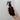 Hand holding an Aromatic Creation black spray bottle labeled 'Wake Up' against a plain background